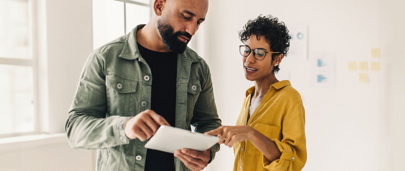 Two people working through a document together